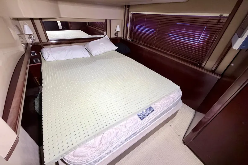 Slide: The Image of Luxurious bedroom interior of 2006 Sea Ray 52 Sedan Bridge yacht with comfortable bedding. - 35