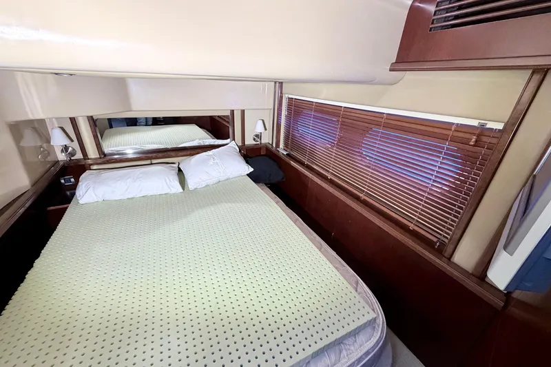 Slide: The Image of Luxurious bedroom interior of 2006 Sea Ray 52 Sedan Bridge yacht. - 36