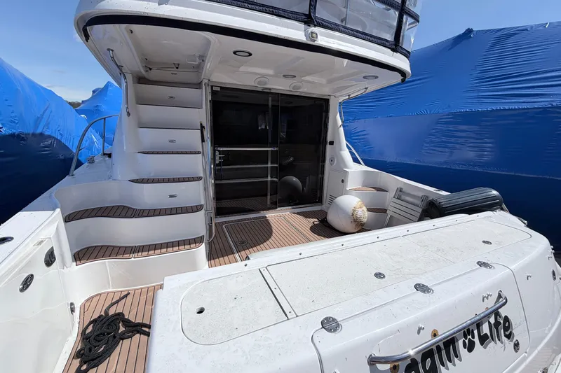 Slide: The Image of 2006 Sea Ray 52 Sedan Bridge yacht with spacious deck and elegant design. - 4