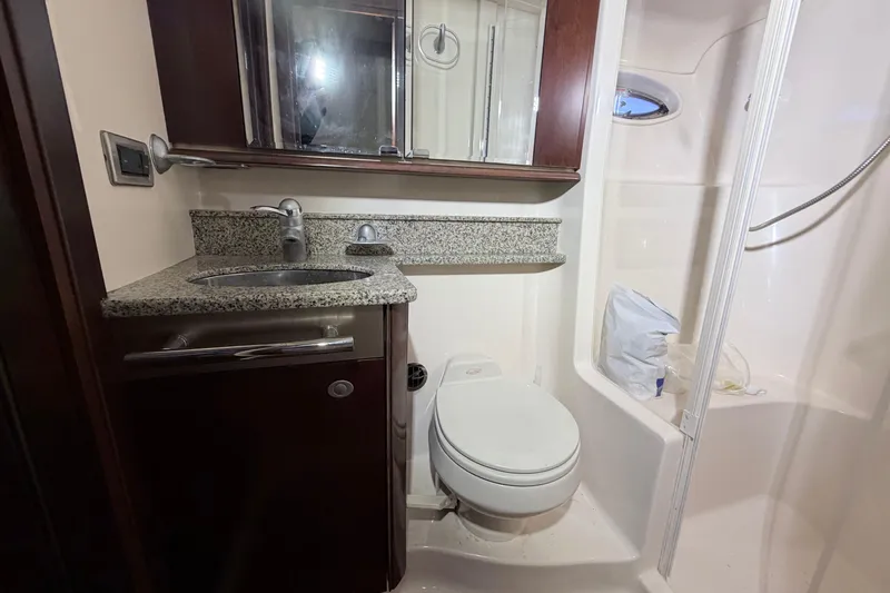 Slide: The Image of Luxurious bathroom in 2006 Sea Ray 52 Sedan Bridge yacht with granite countertop and shower. - 40