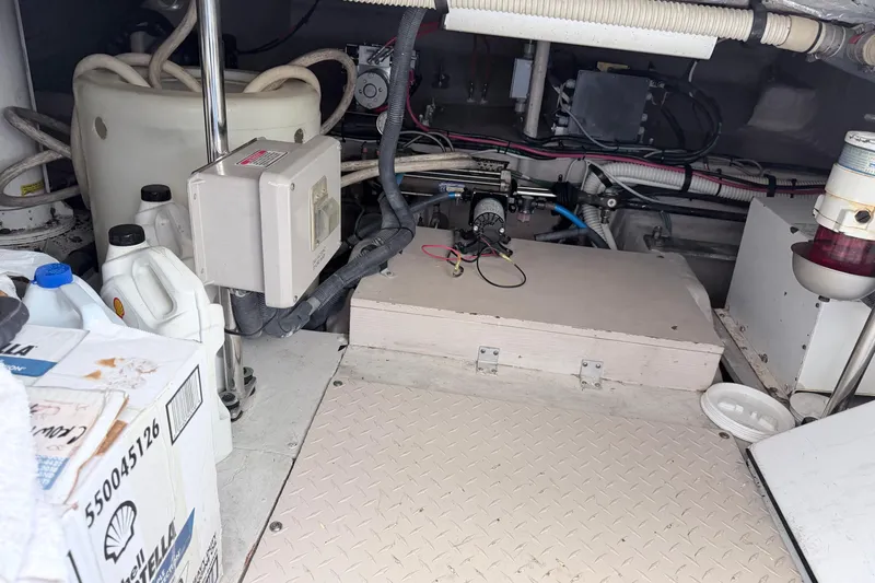 Slide: The Image of Engine room of a 2006 Sea Ray 52 Sedan Bridge with equipment and supplies. - 49