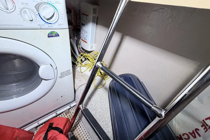 Slide: The Image of Engine room of a 2006 Sea Ray 52 Sedan Bridge with visible wiring and components. - 60