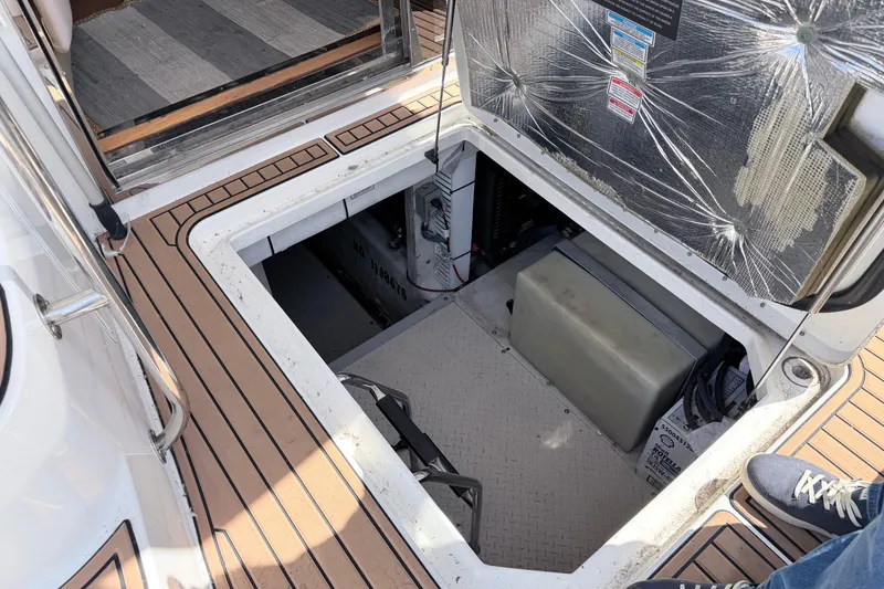 Slide: The Image of Engine compartment of a 2006 Sea Ray 52 Sedan Bridge yacht, showcasing mechanical components. - 61
