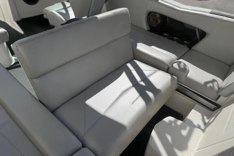 Slide: The Image of 2020 MasterCraft NXT22 boat interior with white seating and modern design. - 17