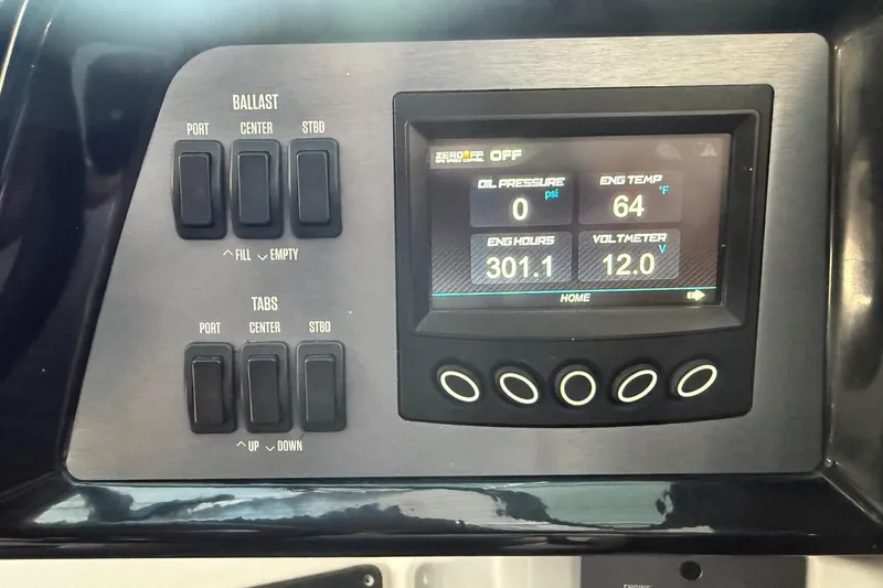 Slide: The Image of Control panel of a 2020 MasterCraft NXT22 boat displaying engine metrics and ballast controls. - 24