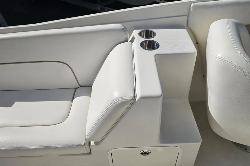 Slide: The Image of 2003 Chris-Craft Launch 28 interior with white seating and dual cup holders. - 10