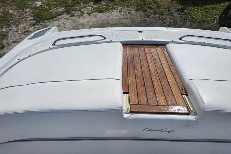 Slide: The Image of 2003 Chris-Craft Launch 28 boat with teak deck and white upholstery. - 11