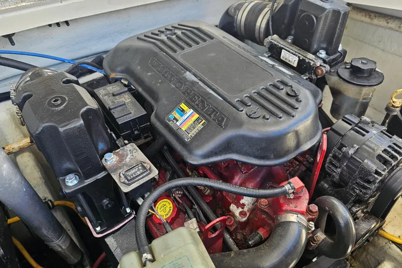 Slide: The Image of Engine compartment of a 2003 Chris-Craft Launch 28 boat, featuring a Volvo Penta engine. - 27