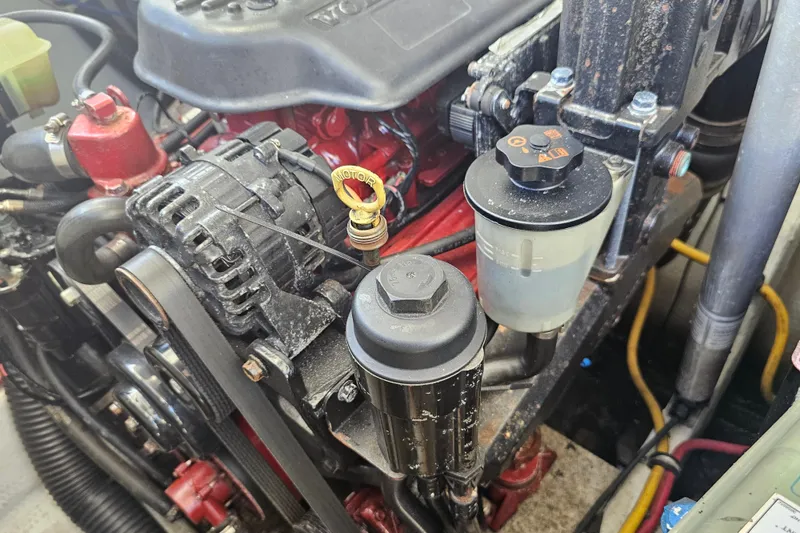 Slide: The Image of Engine compartment of a 2003 Chris-Craft Launch 28 boat, featuring various components. - 28