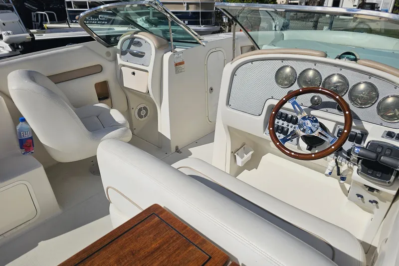 Slide: The Image of 2003 Chris-Craft Launch 28 boat interior with steering wheel and dashboard controls. - 5