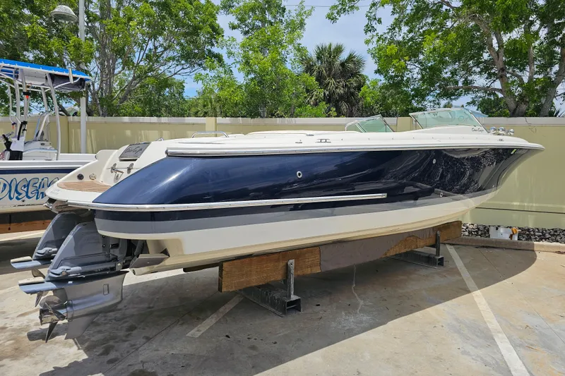Slide: The Image of 2008 Chris-Craft Launch 28 boat on display, featuring sleek design and dual engines. - 2