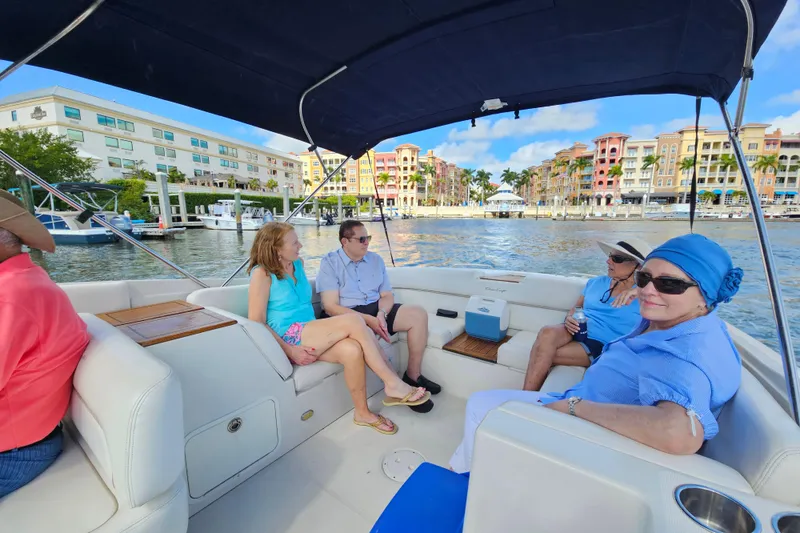 Slide: The Image of 2003 Chris-Craft Launch 28 boat interior with classic dashboard and white seating. - 23
