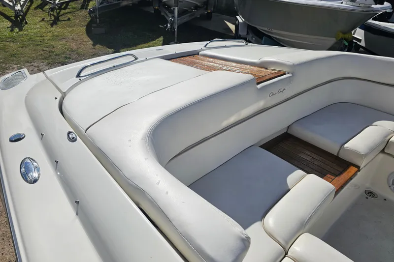 Slide: The Image of 2003 Chris-Craft Launch 28 boat interior with white leather seating and cup holders. - 26