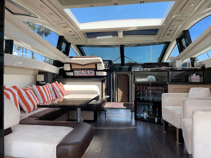 Slide: The Image of Luxurious interior of a 2011 Marquis Sport Coupe yacht with modern seating and skylights. - 12
