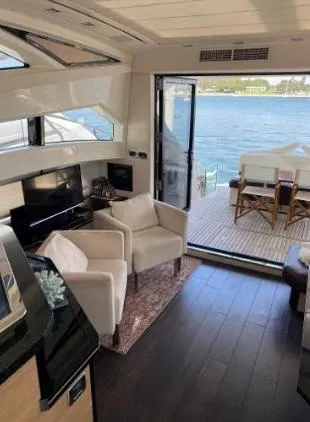 Slide: The Image of Luxurious 2011 Marquis Sport Coupe yacht interior with elegant seating and ocean view. - 18