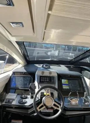 Slide: The Image of 2011 Marquis Sport Coupe helm with modern navigation controls and sleek design. - 19