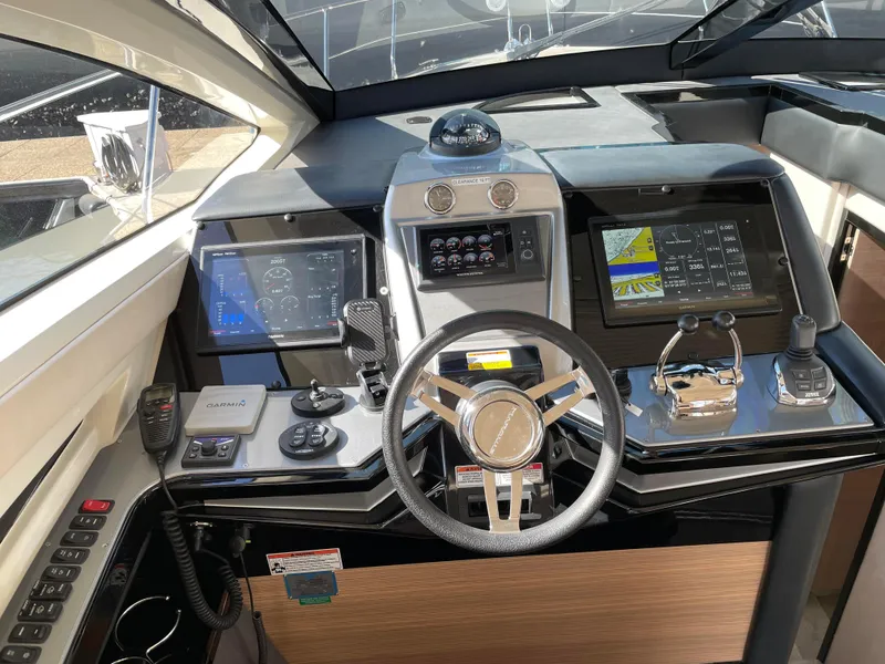 Slide: The Image of 2011 Marquis Sport Coupe helm with advanced navigation and control systems. - 20