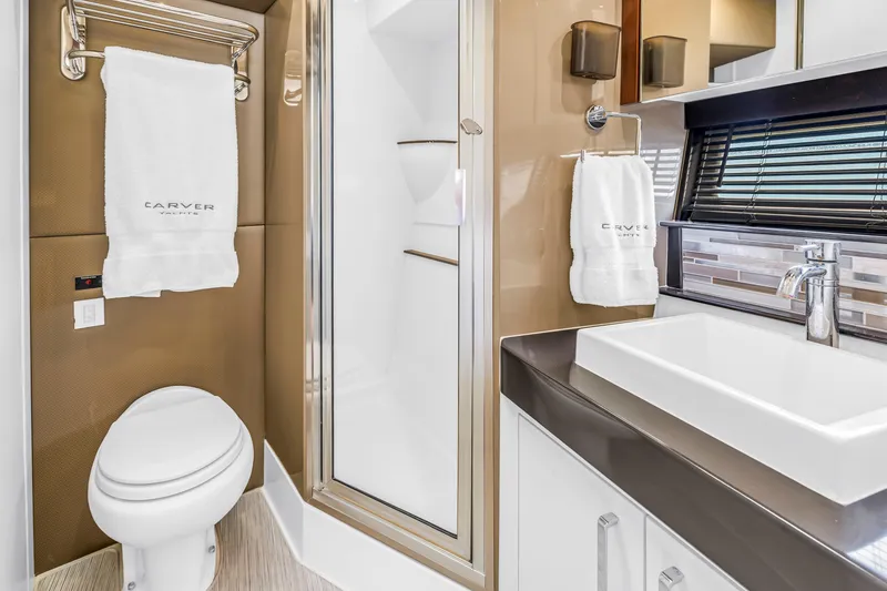 Slide: The Image of Luxurious bathroom in 2018 Carver 40 Command Bridge yacht with modern fixtures and elegant design. - 33