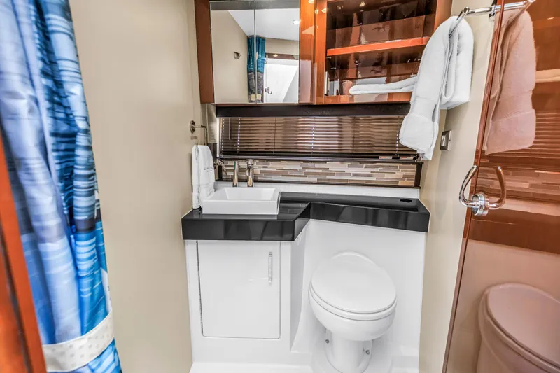 Slide: The Image of Luxurious bathroom in 2018 Carver 40 Command Bridge yacht with modern fixtures and elegant design. - 35