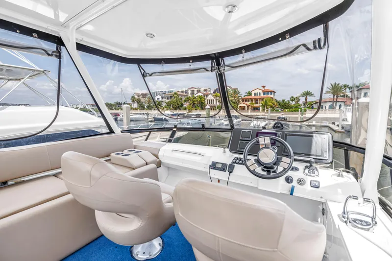 Slide: The Image of Interior view of 2018 Carver 40 Command Bridge yacht with modern helm and seating. - 37