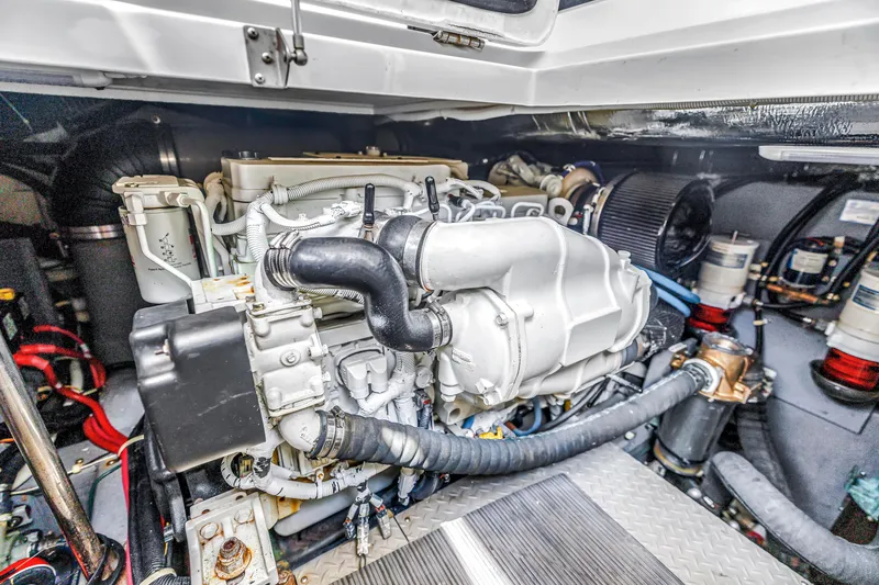 Slide: The Image of Engine compartment of a 2018 Carver 40 Command Bridge yacht, showcasing detailed machinery. - 42