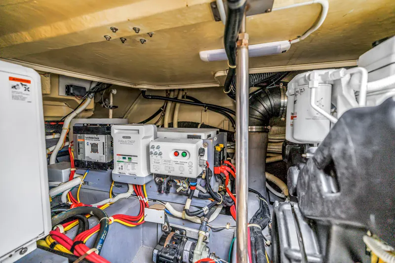Slide: The Image of Engine room of 2018 Carver 40 Command Bridge with electrical components and wiring. - 44