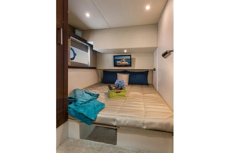 Slide: The Image of Manufacturer Provided Image: Luxurious cabin interior of 2018 Carver 40 Command Bridge yacht with cozy bedding. - 6