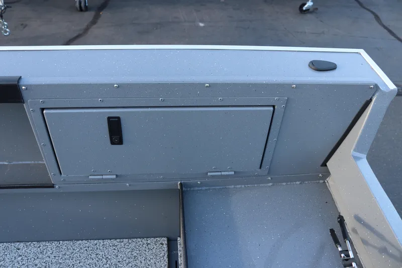 Slide: The Image of 2026 Alumaweld Adventurer 20 boat interior, featuring a storage compartment and sleek design. - 11