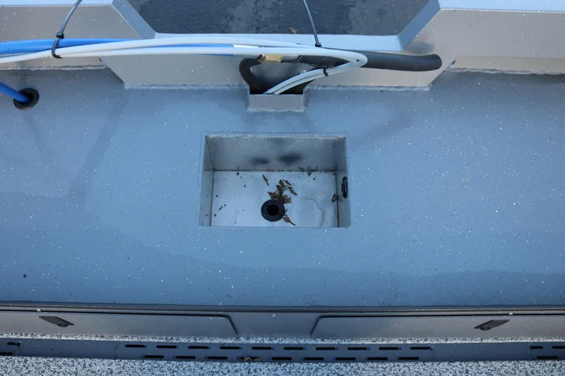 Slide: The Image of 2026 Alumaweld Adventurer 20 boat deck with storage compartment and wiring. - 16