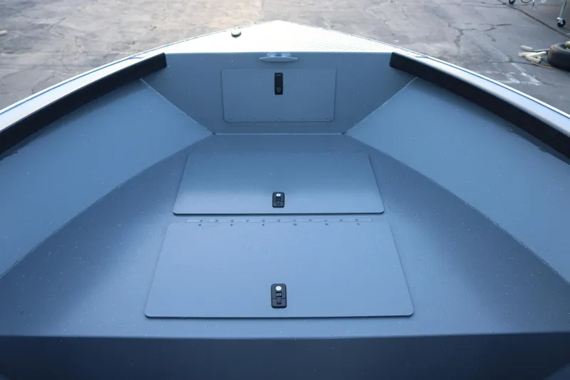 Slide: The Image of 2026 Alumaweld Adventurer 20 boat interior with storage compartments, sleek design. - 18
