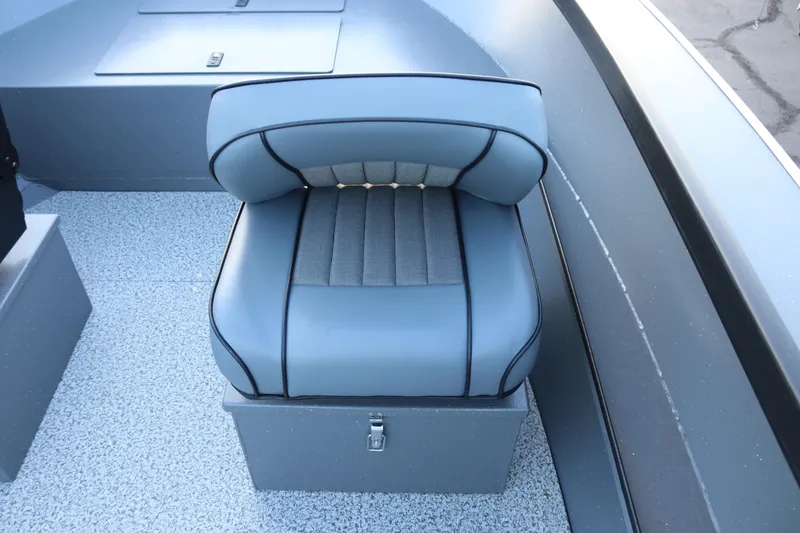 Slide: The Image of 2026 Alumaweld Adventurer 20 boat seat with sleek gray upholstery and storage compartment. - 22