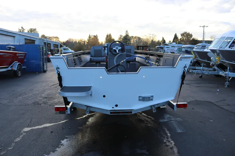 Slide: The Image of 2026 Alumaweld Adventurer 20 boat on trailer, rear view in outdoor setting. - 24