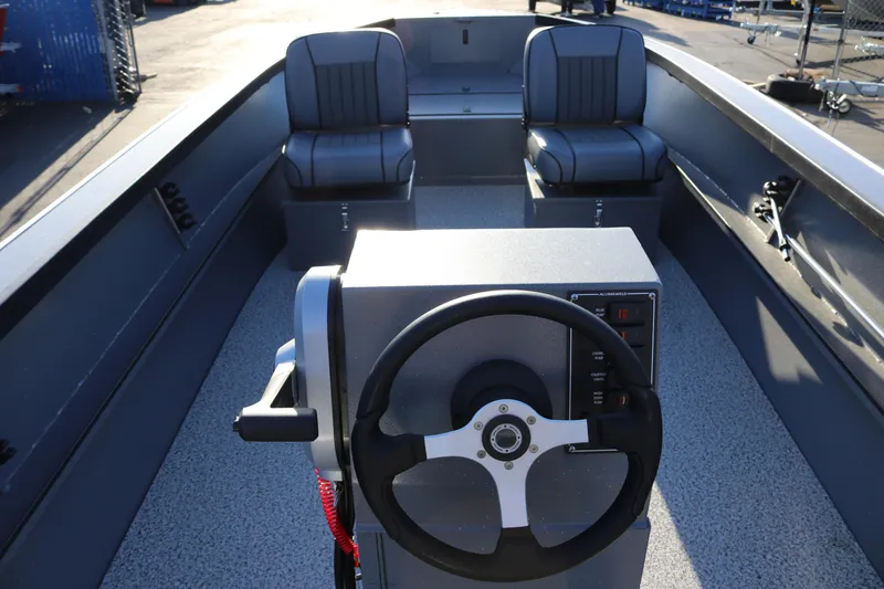 Slide: The Image of 2026 Alumaweld Adventurer 20 boat interior with steering wheel and seating. - 5