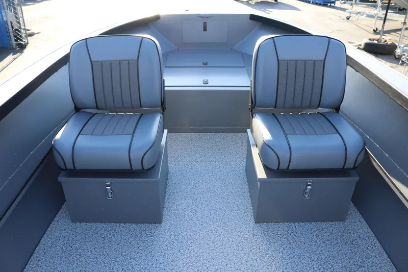 Slide: The Image of 2026 Alumaweld Adventurer 20 boat interior with two cushioned seats and storage compartments. - 6