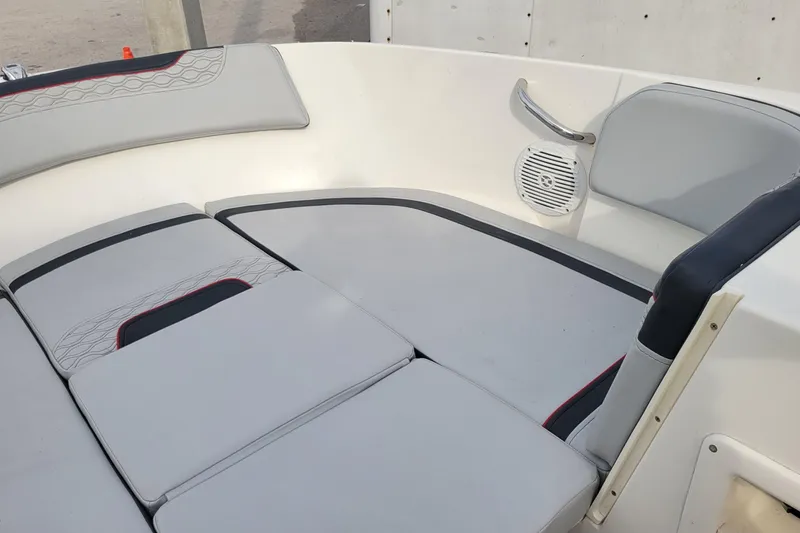 Slide: The Image of 2022 Bayliner Element M17 boat interior with cushioned seating and modern design. - 14