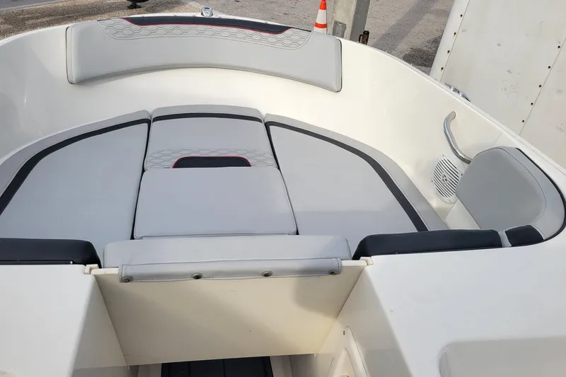 Slide: The Image of 2022 Bayliner Element M17 boat interior with gray seating and speaker. - 15