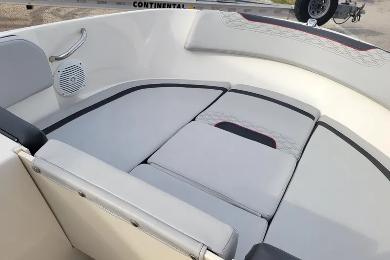 Slide: The Image of 2022 Bayliner Element M17 boat interior with gray seating and modern design. - 16