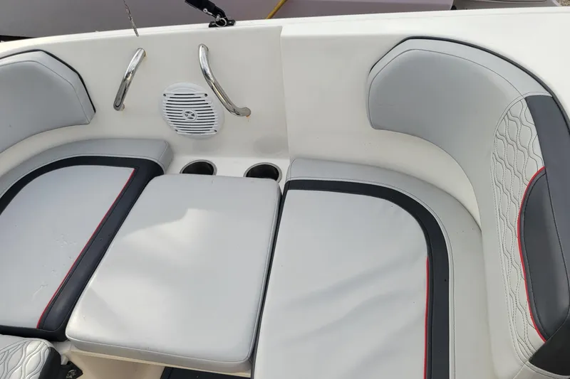 Slide: The Image of 2022 Bayliner Element M17 boat interior with cushioned seating and modern design. - 18