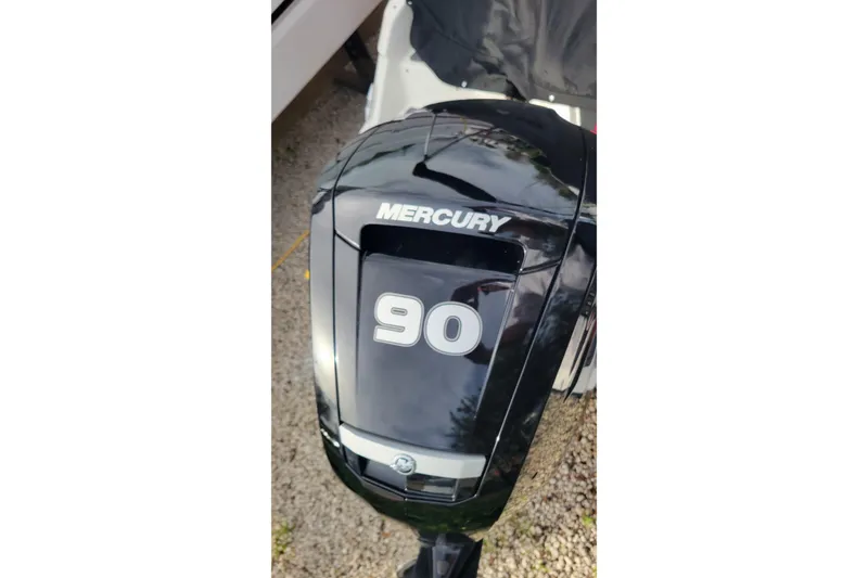 Slide: The Image of 2022 Bayliner Element M17 boat interior with steering wheel and cushioned seating. - 20