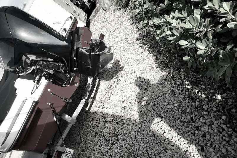 Slide: The Image of 2022 Bayliner Element M17 boat with Mercury outboard motor, parked on a trailer. - 4