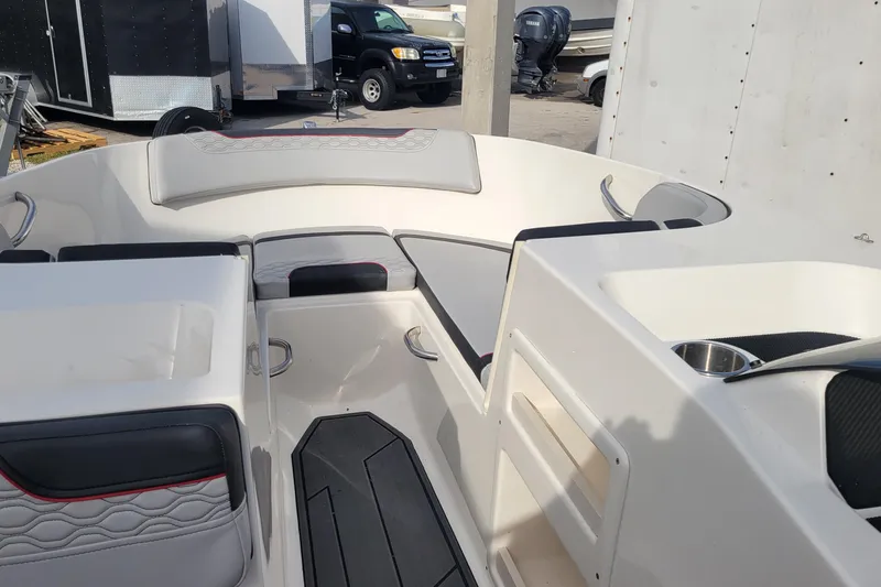 Slide: The Image of 2022 Bayliner Element M17 boat with Mercury outboard motor on a trailer. - 6