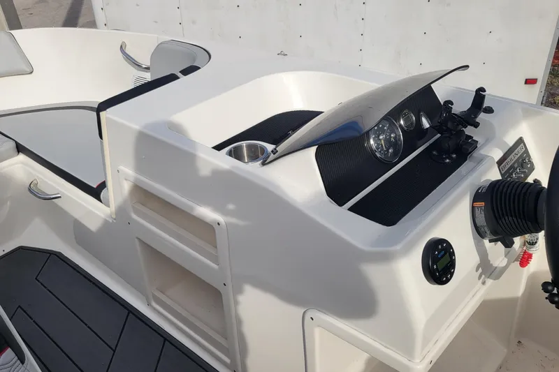 Slide: The Image of 2022 Bayliner Element M17 boat interior with stylish seating and modern design. - 9