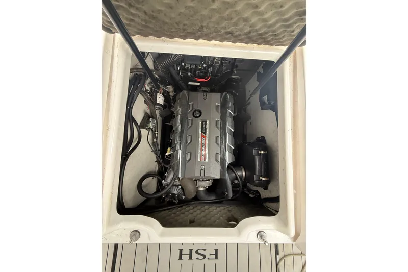 Slide: The Image of Engine compartment of a 2020 Yamaha Boats 195 FSH Sport, showcasing internal components. - 6