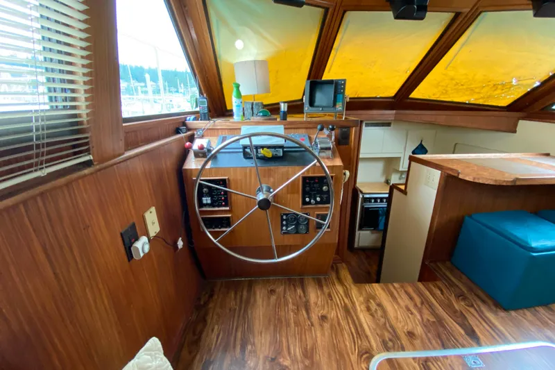 Slide: The Image of 1988 Hatteras 40 Double Cabin helm with wooden interior and navigation equipment. - 4