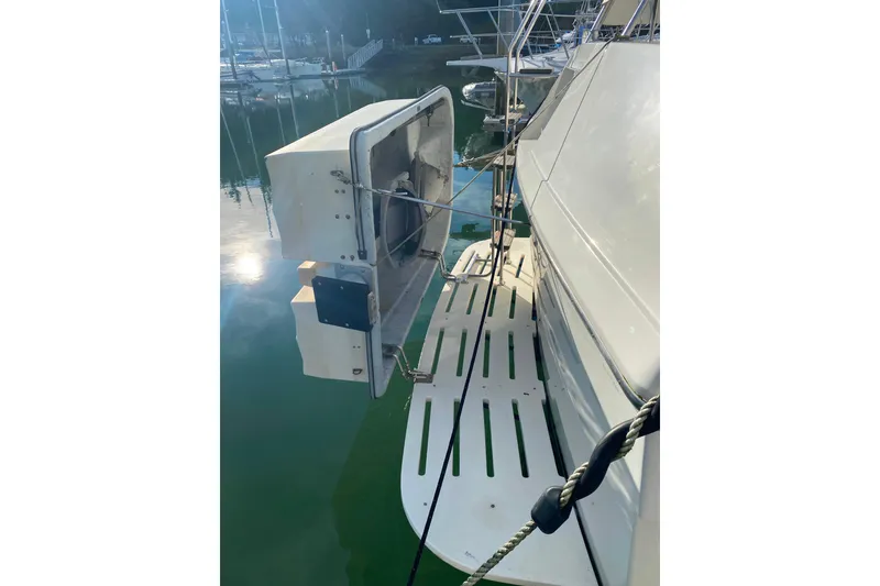 Slide: The Image of 1988 Hatteras 40 Double Cabin yacht with dockside view and equipment details. - 48