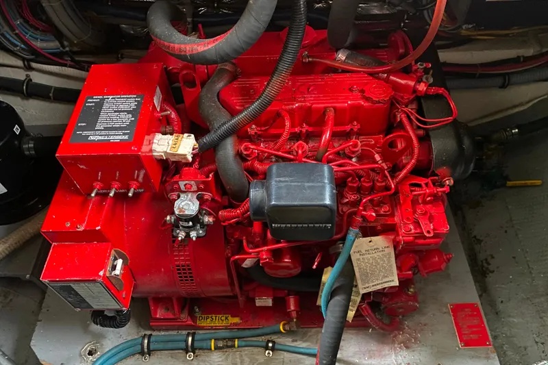 Slide: The Image of Red engine in a 1988 Hatteras 40 Double Cabin boat, detailed view. - 60