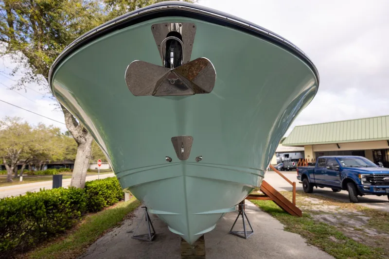 Slide: The Image of 2024 Robalo R360 Center Console boat on display, front view with anchor. - 2