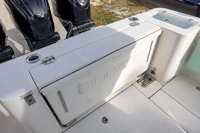 Slide: The Image of 2024 Robalo R360 Center Console boat deck with Yamaha outboard engines. - 5