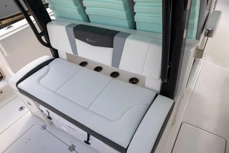 Slide: The Image of 2024 Robalo R360 Center Console boat seating area with cup holders. - 7