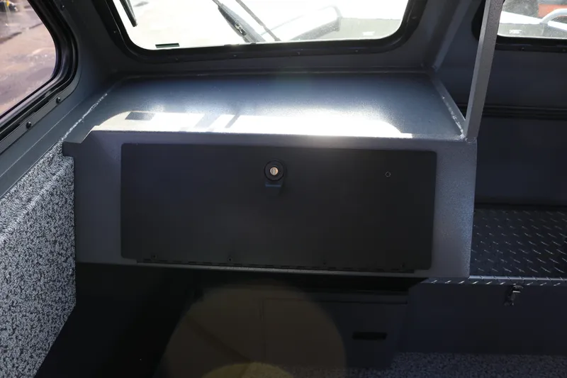 Slide: The Image of Interior view of 2026 Alumaweld Intruder Hard Top 24 boat cabin. - 12